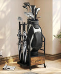 Garage Ready Golf Bag Organizer Rack With Wheels For Easy Single Bag Storage, shown with golf clubs and umbrellas in a room.