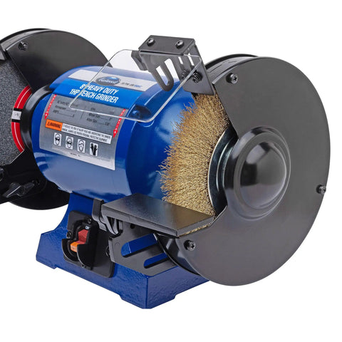 Detail view of Eight Inch Heavy Duty Bench Grinder Workhorse Gutsy One Horsepower Motor Spinning At Three Thousand Four Hundred Fifty Rpm.