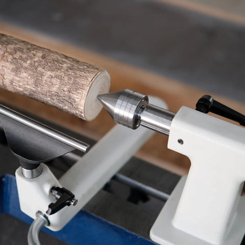 Wood Lathe MT2 Centers Set With Live Center Five Eighths Inch Diameter And Four Pronged Drive Center One Inch Diameter Includes Black Storage Box Ball Bearing Live Center Delivers Smooth Concentric Turning Fits Wood Lathes For Your Shop showing live center in use with wood piece