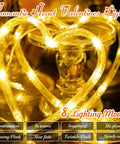Heart Curtain Lights For Valentine's Day And Romantic Room Vibes USB Plug Or Battery Powered 123 LED 11 Heart Light Up String Lights In Warm White Ideal Window Bedroom Closet Wall Decor glowing on a table