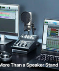 Home studio with audio equipment next to Two Pack Desk Speaker Stands With 15 Degree Tilt For Bookshelf And Desktop Speakers 5 X 8 Inch Anti Vibration Risers For That Clean Loud Sound, Universal Fit, Studio Grade Audio Elevation, Black.