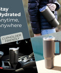 40 Oz Stainless Steel Tumbler With Handle And Straw For On The Go Hydration, shown in cupholder and carried, charcoal color.