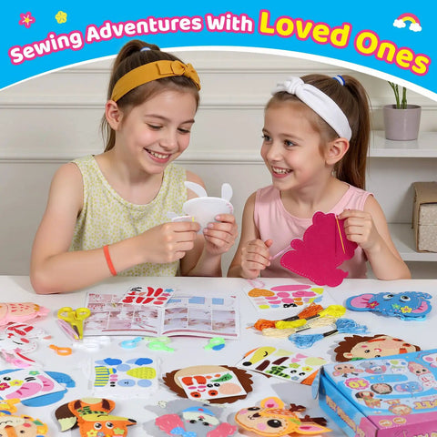 Two smiling girls using Kids Sewing Kit For Beginners With 10 Easy DIY Felt Animal Projects And Guiding Book at a table.