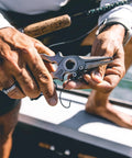 Man using Titanium Fishing Pliers with Side Cutters, Halo Hinge, Lanyard, Leather Sheath, Saltwater Ready on boat