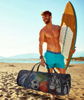 Man on beach carrying Two Pack Large Mesh Dive Bags 37 By 15 By 15 Inches For Diving Snorkeling Beach Travel Gear Storage