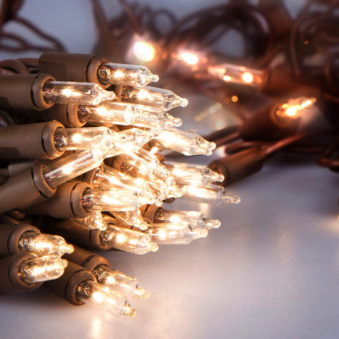Clear Mini Christmas String Lights On Brown Wire Cord For A Cozy Festive Vibe, UL Approved, close-up of lit bulbs