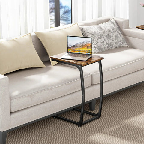 Set Of 2 C Shaped End Tables For Couch With Curved Legs Space Saving Under Sofa Side Tables Slide Under Sofa Or Bed TV Tray Table For Living Room And Bedroom Rustic Brown Finish Adjustable Feet next to beige couch with laptop on top