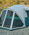 Six Person Family Camping Tent With Screen Porch Weatherproof All Season Large Cabin Style Shelter With Rainfly And Carry Bag For Outdoor Camping And Backyard Ready Green setup near a lake.