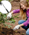 Three Piece Weed Puller Tool Set For Easy Weeding Portable Garden Weeder Hand Tool used by person in garden