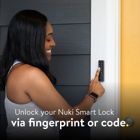 Woman using Slick Smart Deadbolt Lock With Keyless Entry with finger on keypad beside door.