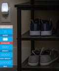 Plug In LED Night Lights With Dusk To Dawn Sensor Ambient Bedroom Glow For Dorm Rooms And Bathrooms Smart Home Friendly Cool White Light Energy Efficient Four Pack illuminating a shelf with shoes