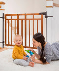 Wood Banister And Stair Safety Gate For Babies And Pets, Adjustable 32 To 48 Inches Wide, 33 Inches Tall, oak finish, installed on banister.