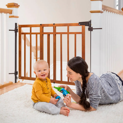 Wood Banister And Stair Safety Gate For Babies And Pets, Adjustable 32 To 48 Inches Wide, 33 Inches Tall, oak finish, installed on banister.