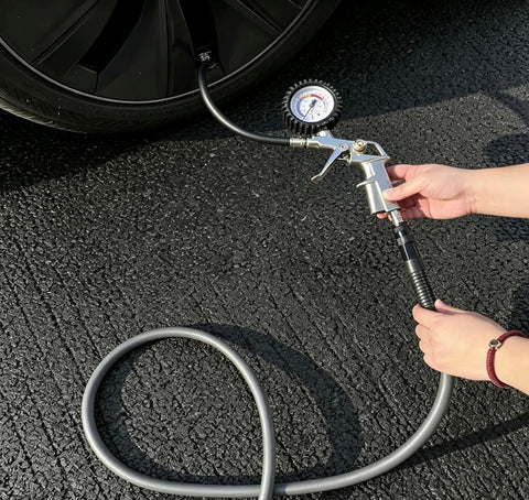 Built Like A Tank 10 Foot Air Compressor Hose Carrying A Quarter Inch Bore Rated At 300 Psi delivers air pressure to a tire.