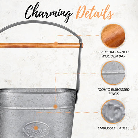 Close-up of galvanized metal bucket with wooden handle, displaying embossed details and rings, highlighting the craftsmanship.