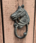 Close-up view of the Handcrafted Cast Iron Horsehead Wall Hook With A Knockout Rustic Coffee Bean Brown Finish built like a tank.