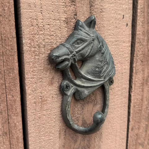 Close-up view of the Handcrafted Cast Iron Horsehead Wall Hook With A Knockout Rustic Coffee Bean Brown Finish built like a tank.