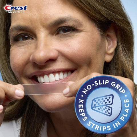 Person applying strip from 3D Whitestrips At Home Teeth Whitening Starter Kit With 10 Treatments, 20 Strips, Upper And Lower, Enamel Safe Formula