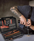 Man drilling into wood with Beast 246-Piece Titanium HSS Drill Bit Set With Carry Case For Metal Wood Masonry And Plastic Drilling