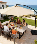Family dining outdoors under 10 Feet Cantilever Offset Patio Umbrella With Base Included, Yarn Dyed Fabric, 8 Rib Sturdy Frame.