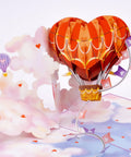 Heart Hot Air Balloon 3D Pop Up Card With Dreamy Sky Scene Gift For Valentines Day Birthday Mothers Day Anniversary Thinking Of You Includes Envelope And Message Note 5x7 Card showcasing heart-shaped balloon among clouds.