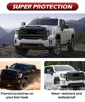 Red Tow Hook Covers for GMC Sierra HD 2500 And 3500 2019 Through 2026 on parked trucks, showcasing rugged style and protection.