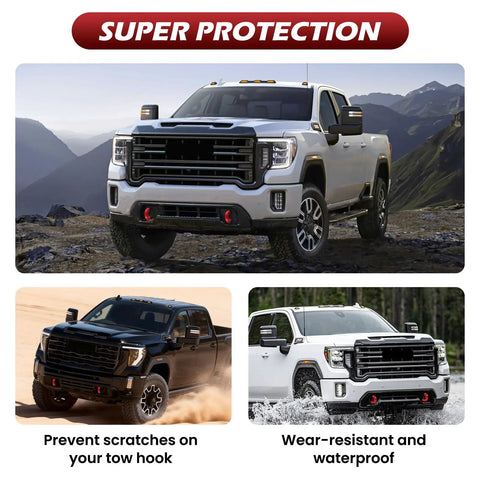 Red Tow Hook Covers for GMC Sierra HD 2500 And 3500 2019 Through 2026 on parked trucks, showcasing rugged style and protection.