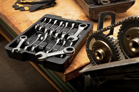14 Piece 12 Point Stubby Ratcheting Wrench Set With SAE And Metric Sizes in tray on workbench in garage