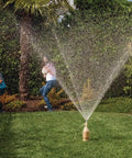 Extreme Geyser Tube Science Kit For Kids With Mentos And Soda Lab Experiment creating a soda eruption in a yard.