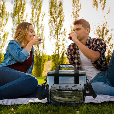 Couple enjoying picnic with Heavy Duty Insulated Cooler Bag With Leakproof Design Soft Portable Lunch Tote, Oxford cloth exterior.