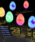 20 LED Solar Easter Egg Lights Outdoor Stake with 25 Ft Cord, 8 Modes Waterproof, colorful eggs with bunny and flower patterns