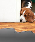 Premium Underlayment For Luxury Vinyl Laminate And Hardwood Floors Beat The Noise Sound Pad 100 Square Foot Roll beside a dog.