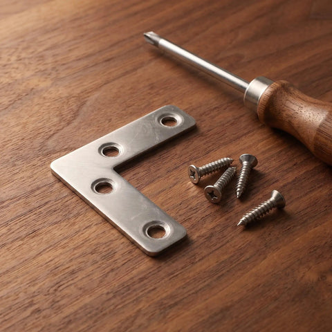 100-Piece Stainless Steel L-Shape Corner Bracket Set for 2x2 Inch Small Angle Joints on wooden surface with screws.