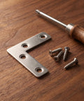 100 Piece L Bracket Corner Brace Set, 2x2 Inch Stainless Steel Angle Joint Brackets with screws and screwdriver on wooden surface
