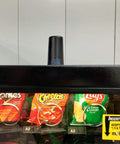 Straight Plug N Go 4G And 5G MIMO Wireless Antenna With Low Profile Panel Mount Setup above snack bags in a vending machine.