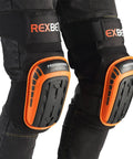 Heavy Duty Work Knee Pads For Men With Gel Foam Cushions Anti Slip Padding For Construction Gardening And Cleaning Thick Comfort Pad Secure Fit With Strong Stretch Straps And Thigh Support All Day Comfort Orange, worn on legs.