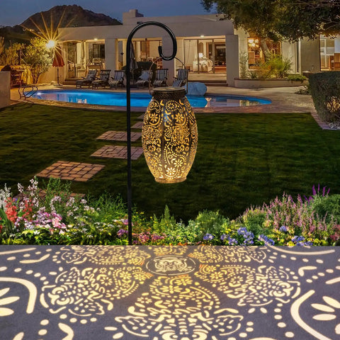Two Pack Owl Solar Lanterns Outdoor Lights Waterproof Large Antique Bronze Garden Decor illuminating a patio at night.