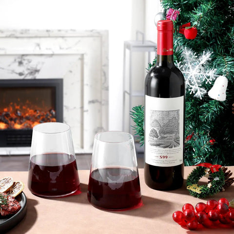 Stemless Wine Glass Set Of 4 Hand Made 16oz Crystal Red And White Wine Glasses For Everyday Use next to wine bottle and Christmas decor