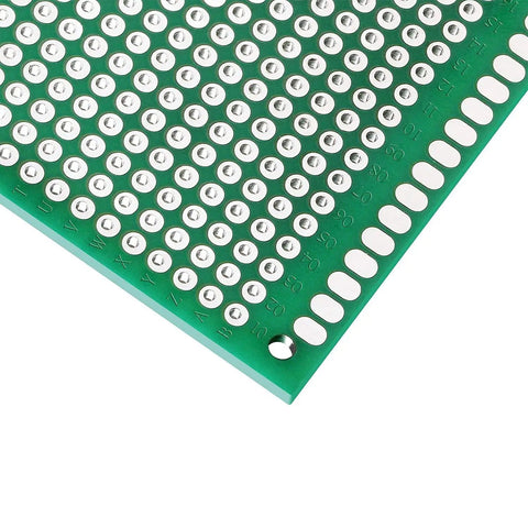 Detail of green 9cm by 15cm double-sided PCB with pre-tinned plated holes, part of Double Sided PCB Prototype Board Set 9cm By 15cm Universal