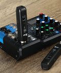 Bluetooth XLR Receiver For Audio Mixers PA Systems And DJ Setups With Professional Wireless Connectivity And High Fidelity Audio shown positioned with audio mixer.