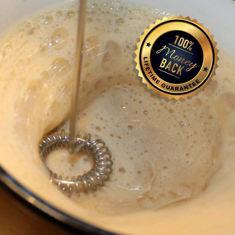 Close-up of foam in a mug created by Badass Little Cordless Handheld Stick Blender Blends Bulletproof Keto Coffee Protein Shakes And Creamers Straight Up Smooth Zero Clumps Guaranteed Wireless Power Mixer.