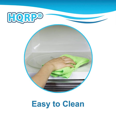 User wiping Fresh Upgrade Glass Turntable Tray For Small Microwaves 9.6 Inch Round Plate clean with a green cloth.