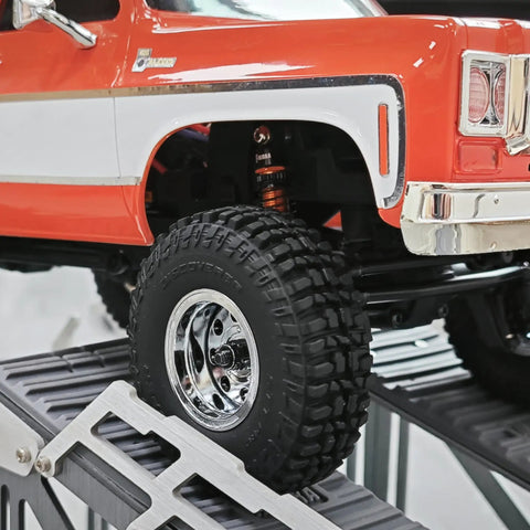 Close-up of RC car suspension with installed 45mm Aluminum Threaded Oil Shock Absorbers For One Twenty Fourth FCX24 And FMS