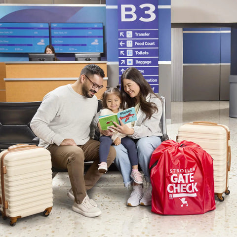 Family with suitcases at airport next to Gate Check Travel Bag For Compact Fold Strollers With Built In AirTag Holder Red.