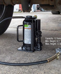 12-Ton Heavy Duty Air Hydraulic Bottle Jack For Cars And Trucks Pro Grade With Fully Welded Base Flash Chrome Ram Aluminum Piston shown lifting vehicle