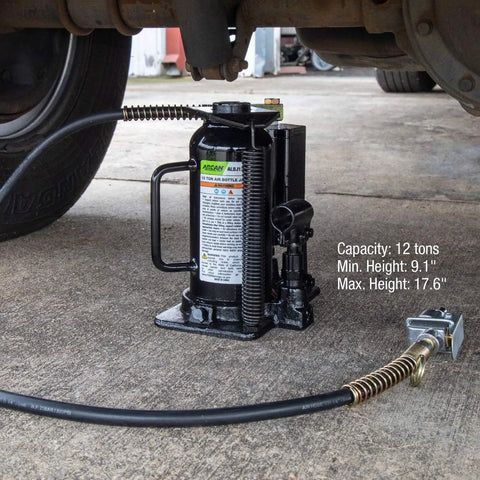 12-Ton Heavy Duty Air Hydraulic Bottle Jack For Cars And Trucks Pro Grade With Fully Welded Base Flash Chrome Ram Aluminum Piston shown lifting vehicle