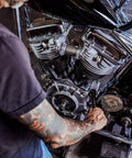 Mechanic using 8-In-1 SAE Ratcheting Wrench Set In Two Pieces With Hollow Sockets And Double Box End Design on motorcycle engine