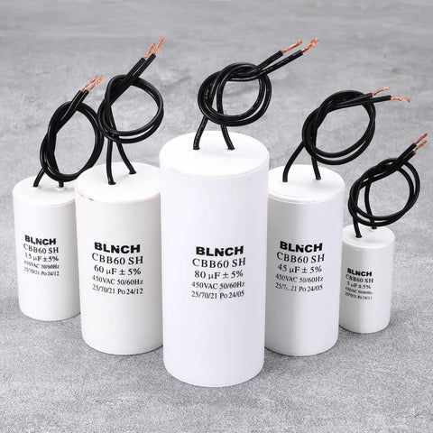 Assorted BLNCH CBB60 SH capacitors, white, labeled 15-80uF, 450VAC, for single-phase motors in HVAC and appliances