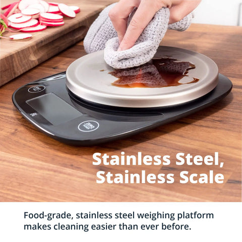 Digital Food Scale With Stainless Steel Bowl being cleaned, showcasing spill-resistant design and tare function.