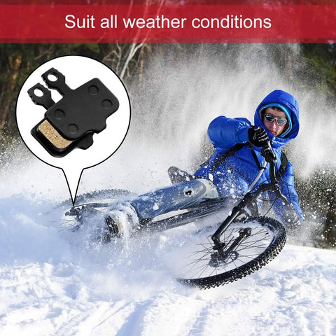 Mountain biker in snow demonstrating 4 Pairs Resin Disc Brake Pads For Mountain Bikes With Dope Stopping Power Compatible With Elixir 1 3 5 7 9 R And Sram XO XX X7 X9 XXWC DB1 DB3 DB5 Low Noise Quick Break In Smooth Modulation Durable Replacement Pads.